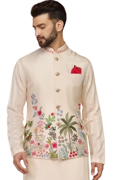 Man wearing white embroidered jacket with floral and botanical motifs and red pocket square.